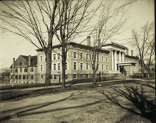 B&W photo of an early 20th-century multi-store hospital building