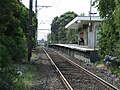 Southbound view of the former ground level Platform 2 and station building, December 2012