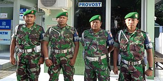 Indonesian Army provosts pose outside their Guardhouse Indonesian Army provosts.jpg