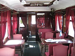 Interior of the saloon coach where the lunch was held. This coach is now located in the town of Sastamala in the Pirkanmaa region. Marskin salonkivaunun interiooria.JPG