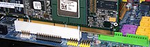 A semi-inserted PCI-X card in a 32-bit PCI slot, illustrating the need for the rightmost notch and the extra room on the motherboard to remain backward compatible PCI-X in a 32-bit slot.jpg