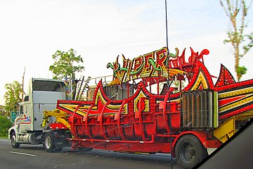 Part of a carnival ride being transported