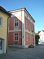 Heutige Position des Tores mit dem ehemaligen Pflasterzollhaus (rotes Gebäude)