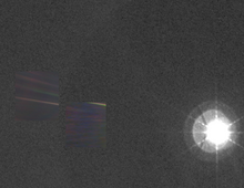 The wide-angle photograph of the Sun and inner planets (not visible), with Pale Blue Dot superimposed on the left, Venus to its right View of the Sun, Earth and Venus from Voyager 1.png