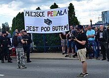 Counter-protesters against the 2019 equality march in Rzeszow: "fag's place is under the boot!" 02019 0057 MW-Protesters chant Nazi slogan in Rzeszow - fag's place is under the boot!.jpg