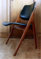 The '36' dining chair i teak and leatherette upholstery