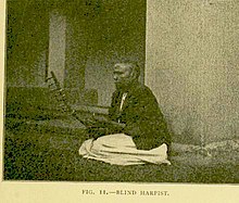 A blind Buganda harpist c. 1911 Blind Baganda Harpist.jpg