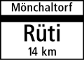 4.30 End of town/village on minor road (mentions next village/town above and distance to next major place(s) below the horizontal line)