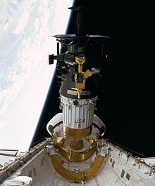 Galileo is prepared for release from Space Shuttle Atlantis. The Inertial Upper Stage (white) is attached. Galileo probe deployed (large).jpg