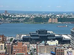 Hudson from midtown Manhattan with Javits Convention Center in foreground. The beginning of the Palisades is visible across the river.