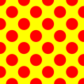 Red polka dots on a yellow background