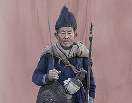 A Rai-Kirati priest wearing a kukri on his waist