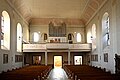 Het interieur, gezien richting het ingangsportaal en het orgel op de galerij.