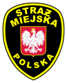 Insignia de la policía municipal polaca (Straż Miejska), utilizando Ƶ barrada como variante de Ż