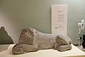 Statue of a lion with inscription.