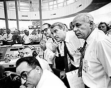 George Mueller, Wernher von Braun, and Eberhard Rees watch the AS-101 launch from the firing room. VonBraunMuellerReesSA6.jpg