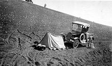 "Picturesque camp made by a lone geologist on the cinders of Inferno". This photo was taken during a U.S. Department of the Interior Geological Survey in 1921. CratersOfTheMoonFordTent.jpg