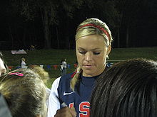 Jennie Finch signing autographs. From 1998 to 2010, Finch became the most recognizable face on a dominant squad. Her 2004 Olympics showing put her on an elite level, as she helped lead the USA softball team to a gold medal. Jennie Finch Alta Springs 1.jpg