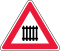 Level crossing ahead, with gates