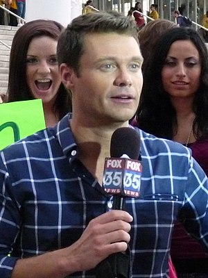 English: Ryan Seacrest tapes a promo with some...
