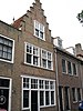 Logegebouw: huis met gepleisterde (gemutileerde) trapgevel