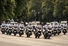 (2) Police officers on motorcycles escort Queen Elizabeth II in Berlin during a state visit to Germany, 2015 20150626 Queen auf dem Weg nach Tegel mit Eskorte am Grossen Stern IMG 5682 by sebaso.jpg