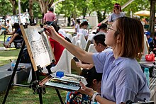 A group of urban sketchers drawing and painting outside the Asian Civilisation Museum in Singapore.