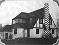 Rear view a French-style home designed by Schimek in La Grange, Illinois, as seen in 1925.