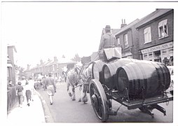 A drayman in the 1940s hauling barrels