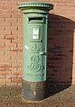 Green painted Edward VII pillar box at Rosslare Harbour