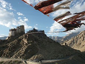 Prayer flags connect the two peaks of the peak...