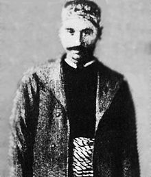 Seorang lelaki dengan pakaian Arab Syam