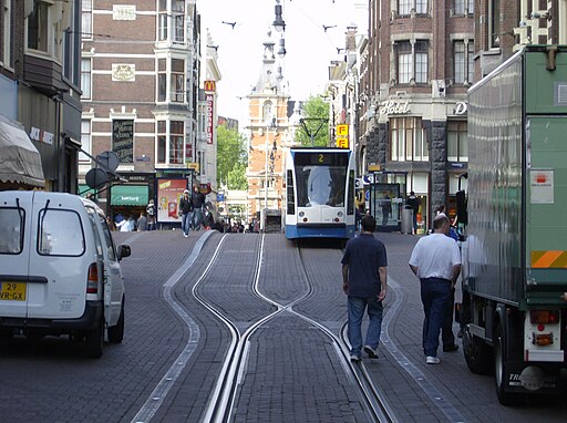 Public transport, goods delivery, private transport as well as pedestrians in Leidsestraat, Amsterdam