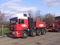 ALE MAN ballast tractor with drawbar connected to a hydraulic modular trailer.