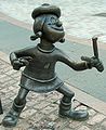 Image 76Statue of Minnie the Minx, a character from The Beano, in Dundee, Scotland. Launched in 1938, The Beano is known for its anarchic humour, with Dennis the Menace appearing on the cover. (from Culture of the United Kingdom)