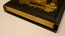 Gilded page edges on a book Old book with gilded page edges.JPG