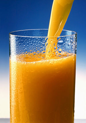 A glass of Orange juice.