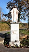 Photographie en couleurs, représentant une statue du Christ.