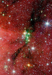 The Serpens South star cluster is embedded in a filamentary molecular cloud, seen as a dark ribbon passing vertically through the cluster. This cloud has served as a testbed for studies of molecular cloud stability. Serpens south.jpg