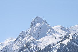 Picture shows the snow covered but still rocky summit area of the Tschaggunser Mittagsspitze during a cloudless winterday