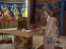 A contemporary Byzantine Catholic altar during the Divine Liturgy at St. Joseph Church in Chicago, Illinois. At altar.JPG