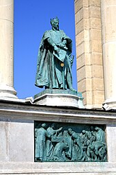 A crowned man holding a sealed document