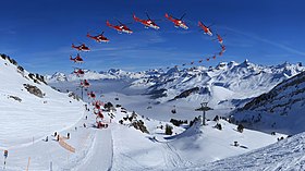 Sequence image of mountain take-off by an Agusta A109 SP Grand "Da Vinci" helicopter from Rega air rescue service CH.SZ.Stoos Fronalpstock Sequence Rescue-Helicopter REGA 16K 16x9-R.jpg