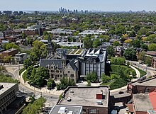 Aerial view showing the original southern portion to the left, and the discordant new north side Daniels Building at One Spadina Crescent Toronto May 27 2023.jpg