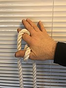 5. The hand is rotated around the front rope, the index finger gets under then points up.