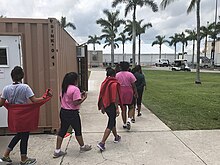 Unaccompanied minors walk in a Homestead, Florida, facility supervised by the Office of Refugee Resettlement, on June 20, 2018. Homestead Florida Unaccompanied Minors.jpg
