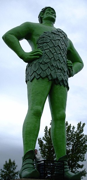 A statue of the Jolly Green Giant towers above...