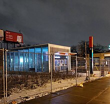 Photo of glass panelled subway station entrance