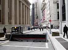 South end of Nassau Street; Federal Hall National Memorial is on the left, the New York Stock Exchange Building is in the distance on the right Nassau Street barrier from Pine towards Wall jeh.jpg