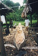 Warao Indians constructing a traditional dugout canoe, Orinoco delta. Simoina area, Delta Amacuro, Venezuela.